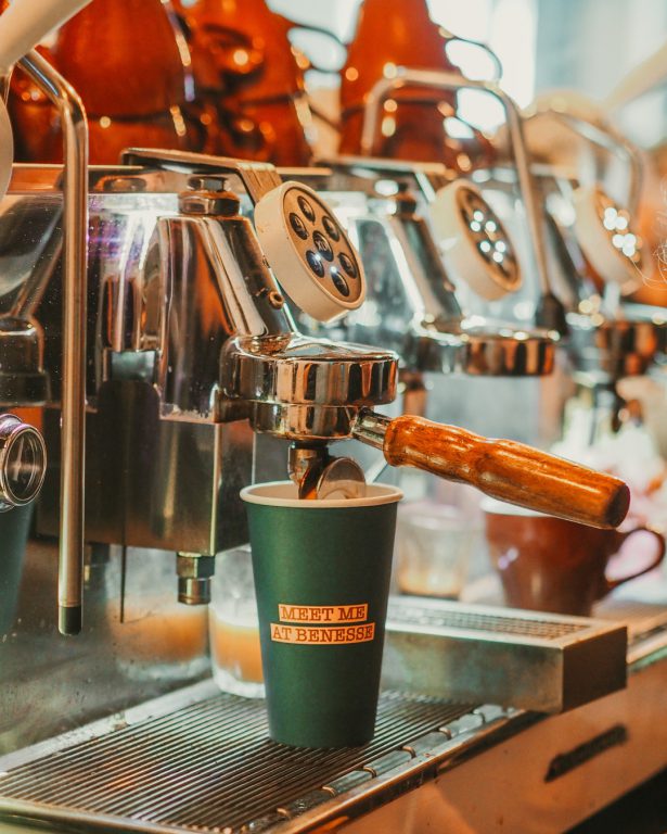 Image of a coffee cup under the Coffee machine at Benesse Cafe