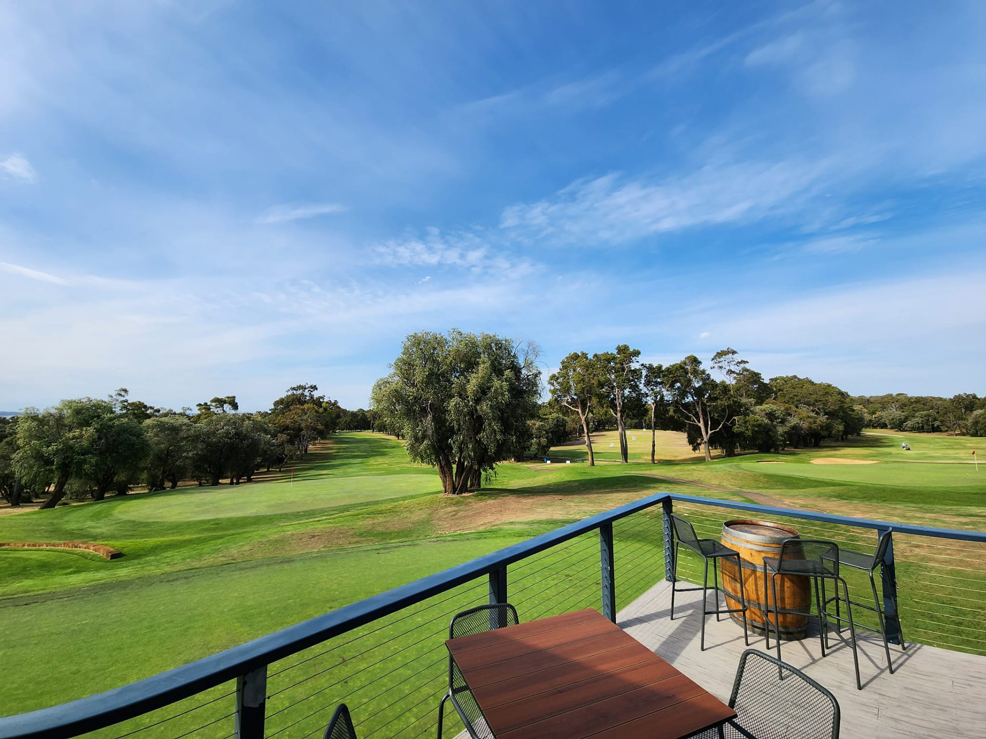 Image of the Bunbury Golf Course overlooking the green from the outside balcony at the restaurant