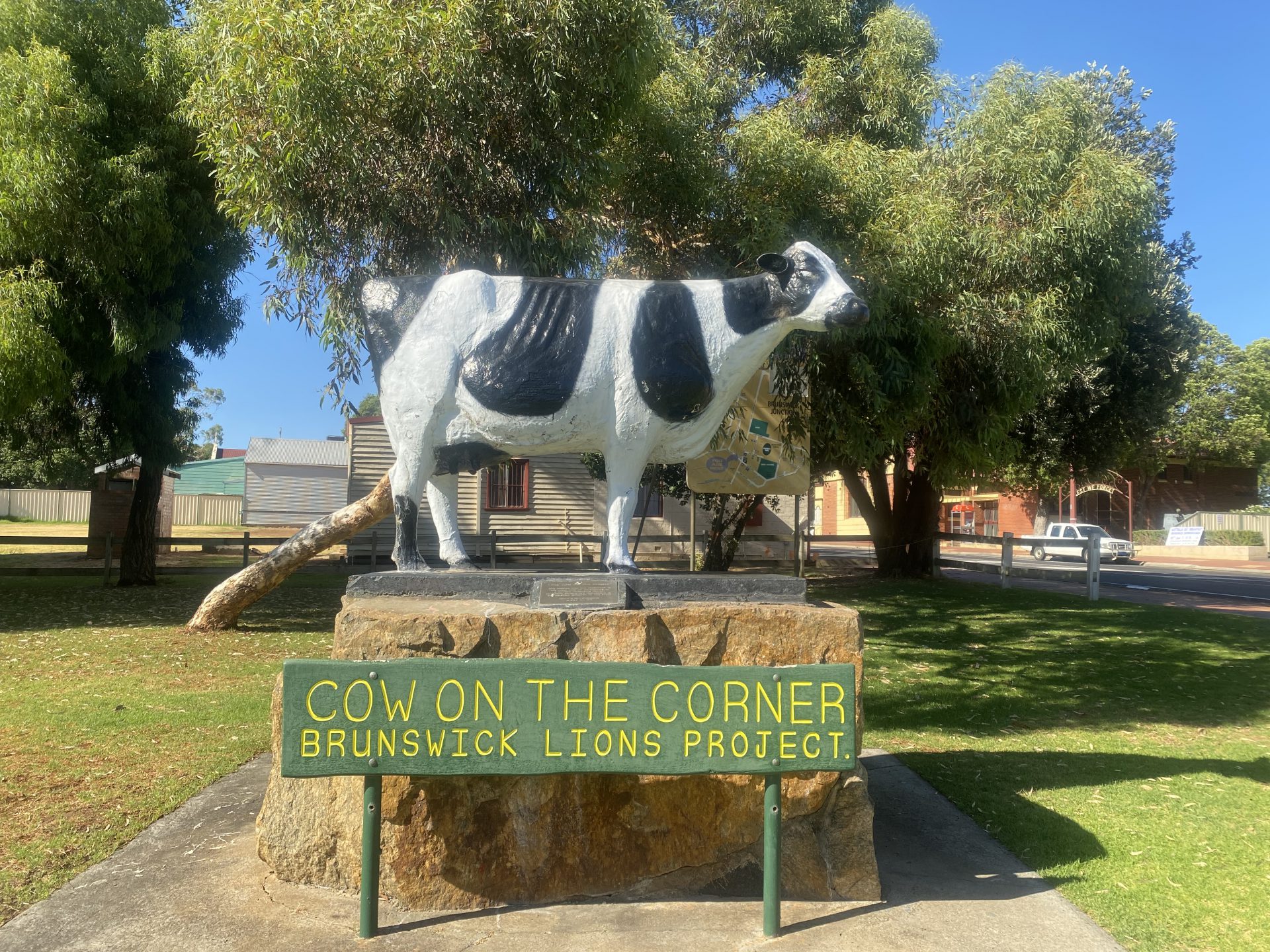 Image of Daisy the Cow statue with a sign in front stating the name