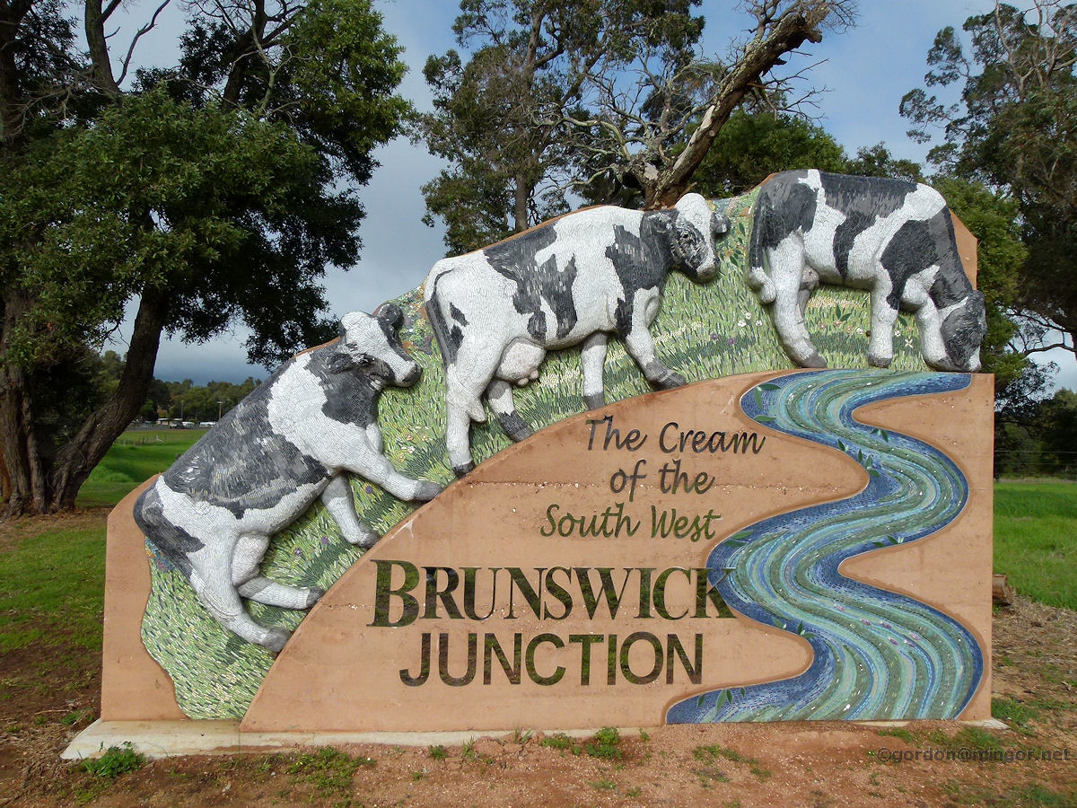 Image of the Brunswick Junction Entry Statement with cows and a river Mural