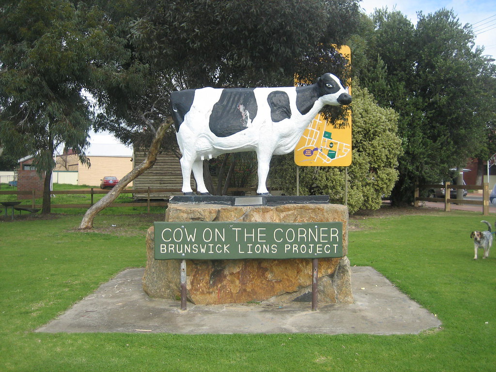Image of Daisy the Cow statue with a sign in front stating the name