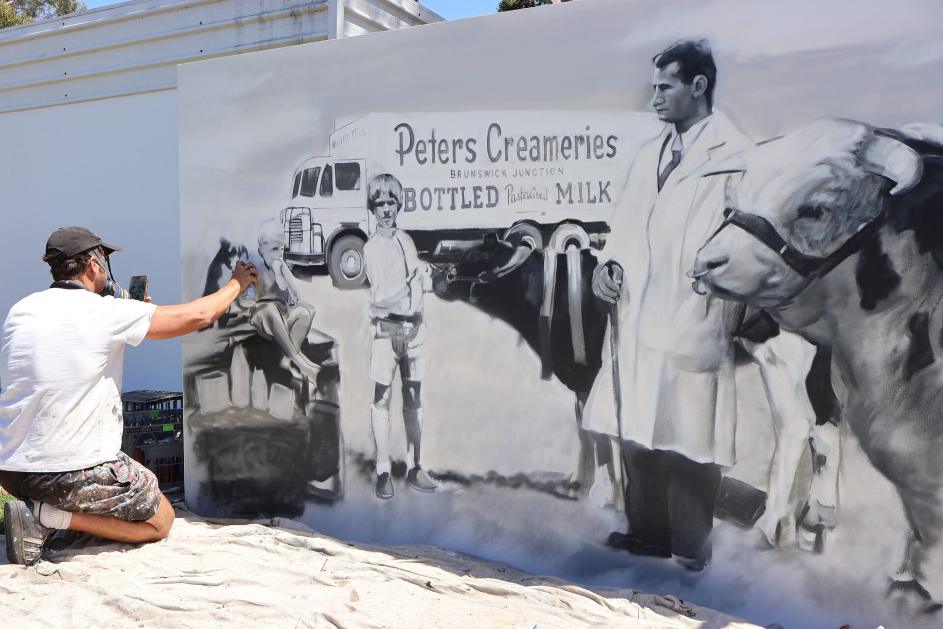 A man painting a mural