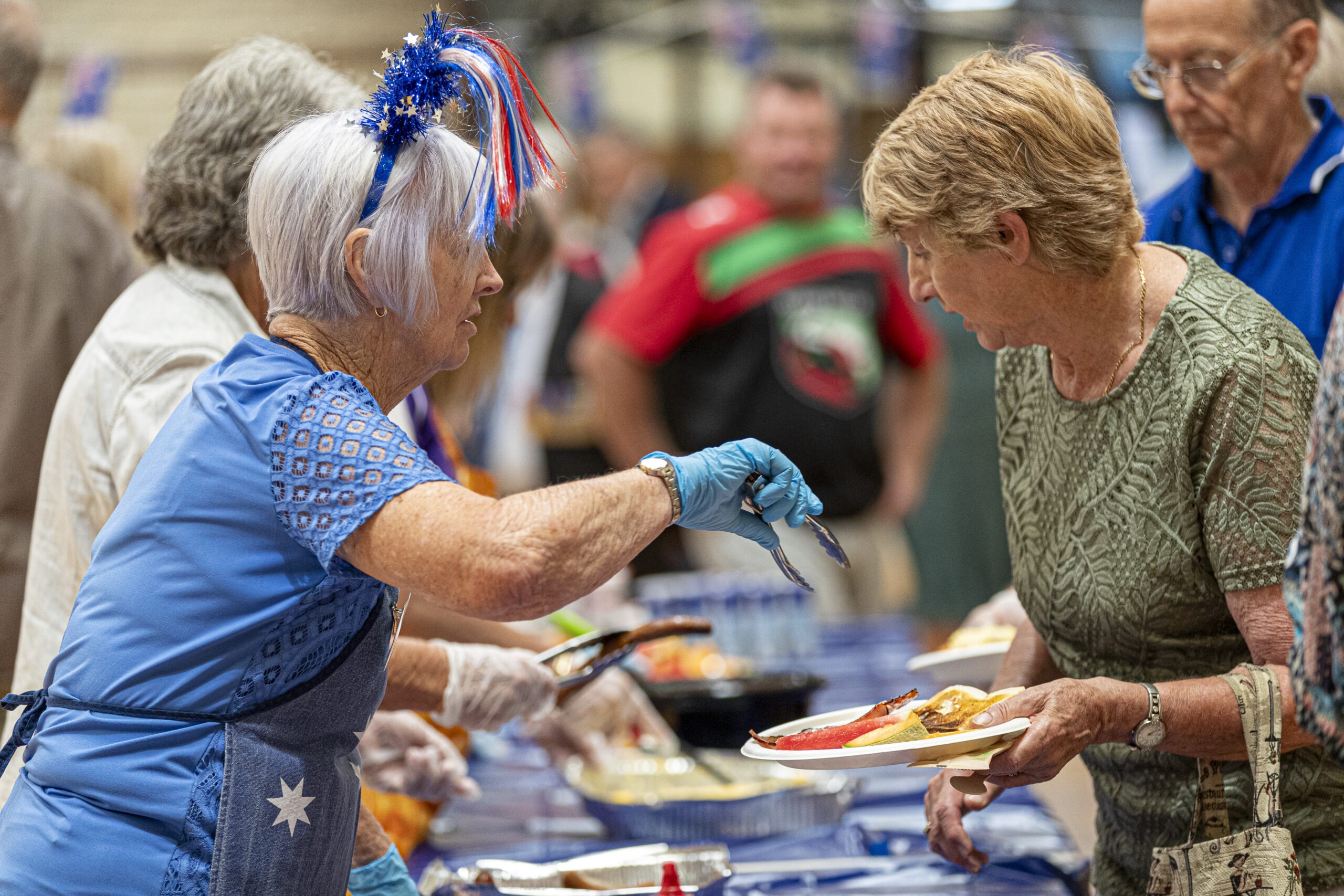 Image of people serving food