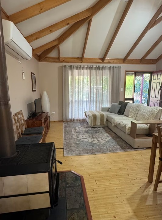 Estuary-Cottage-Living-with-wood-fire-and-air-conditioning.jpg